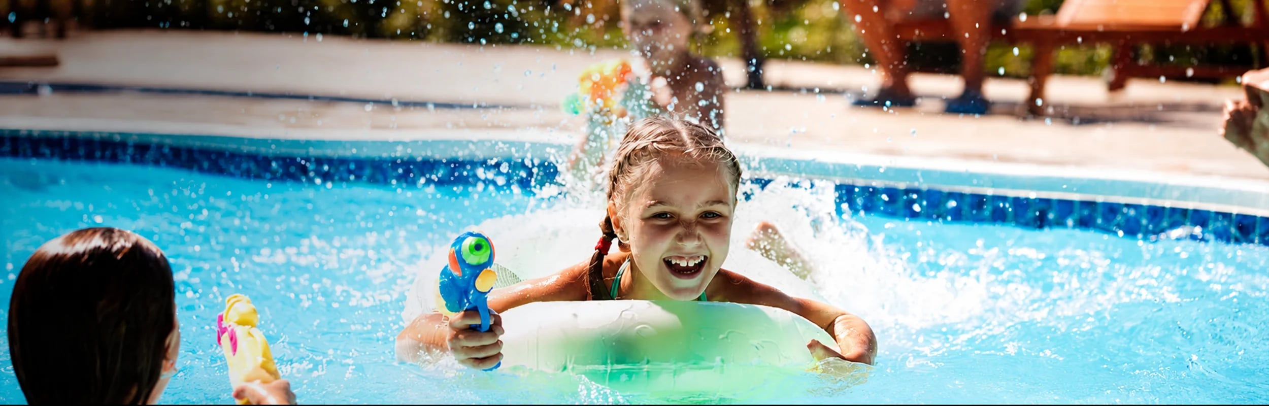 A girl playing in the pool of a vacation rental home